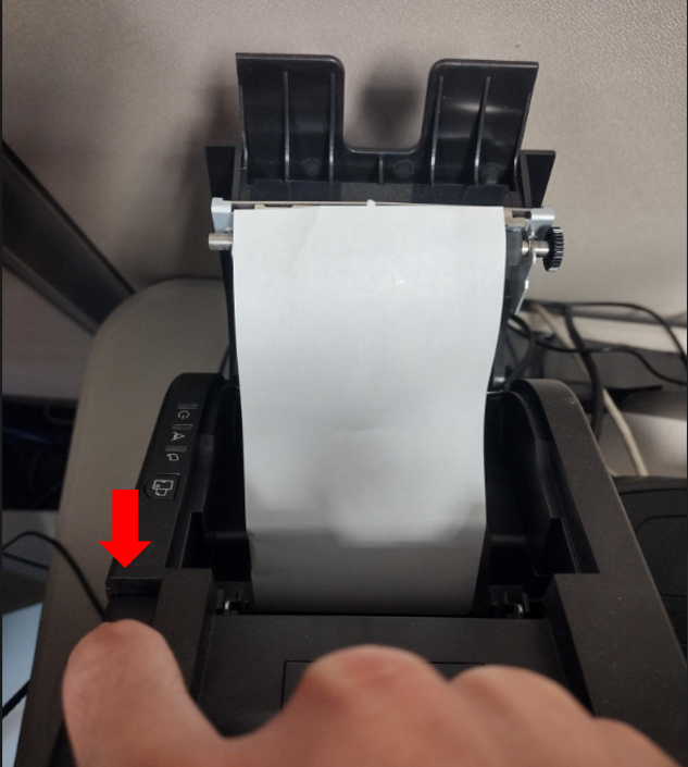 Replacing the paper roll in a POS Receipt Printer